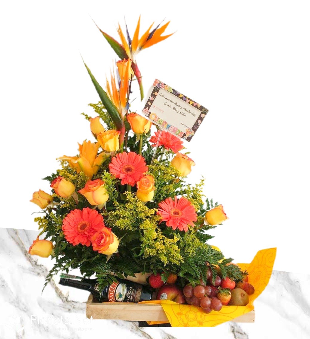 Fruit bowl accompanied by flowers